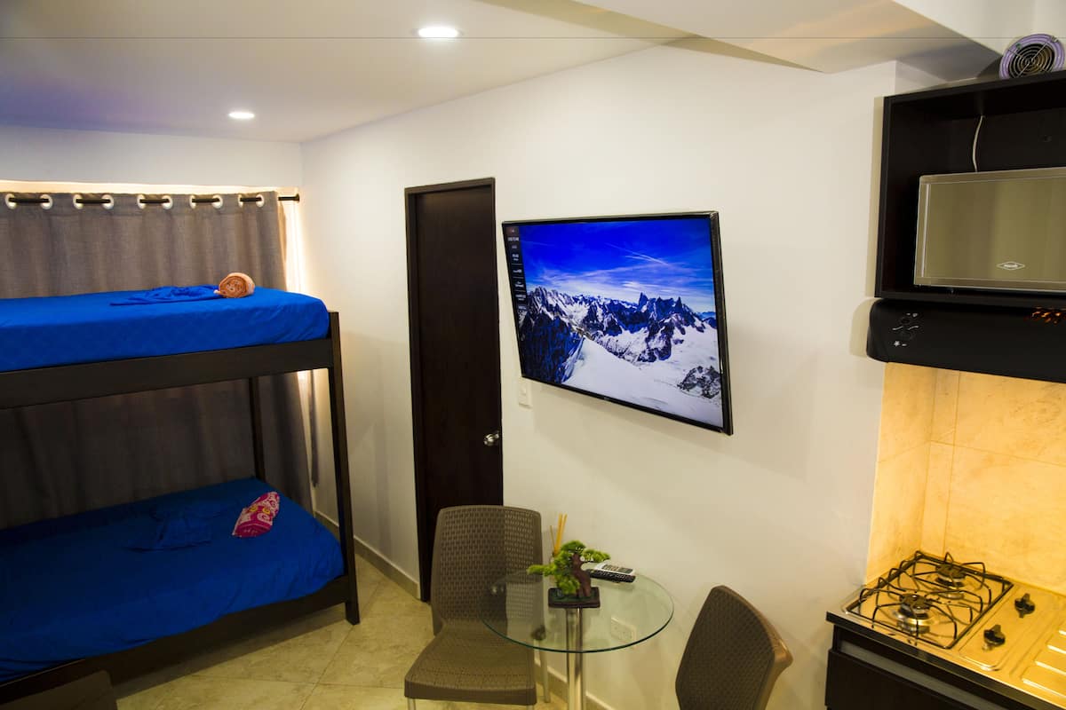 Family Suite, Multiple Beds | Laptop workspace, iron/ironing board, free WiFi, bed sheets