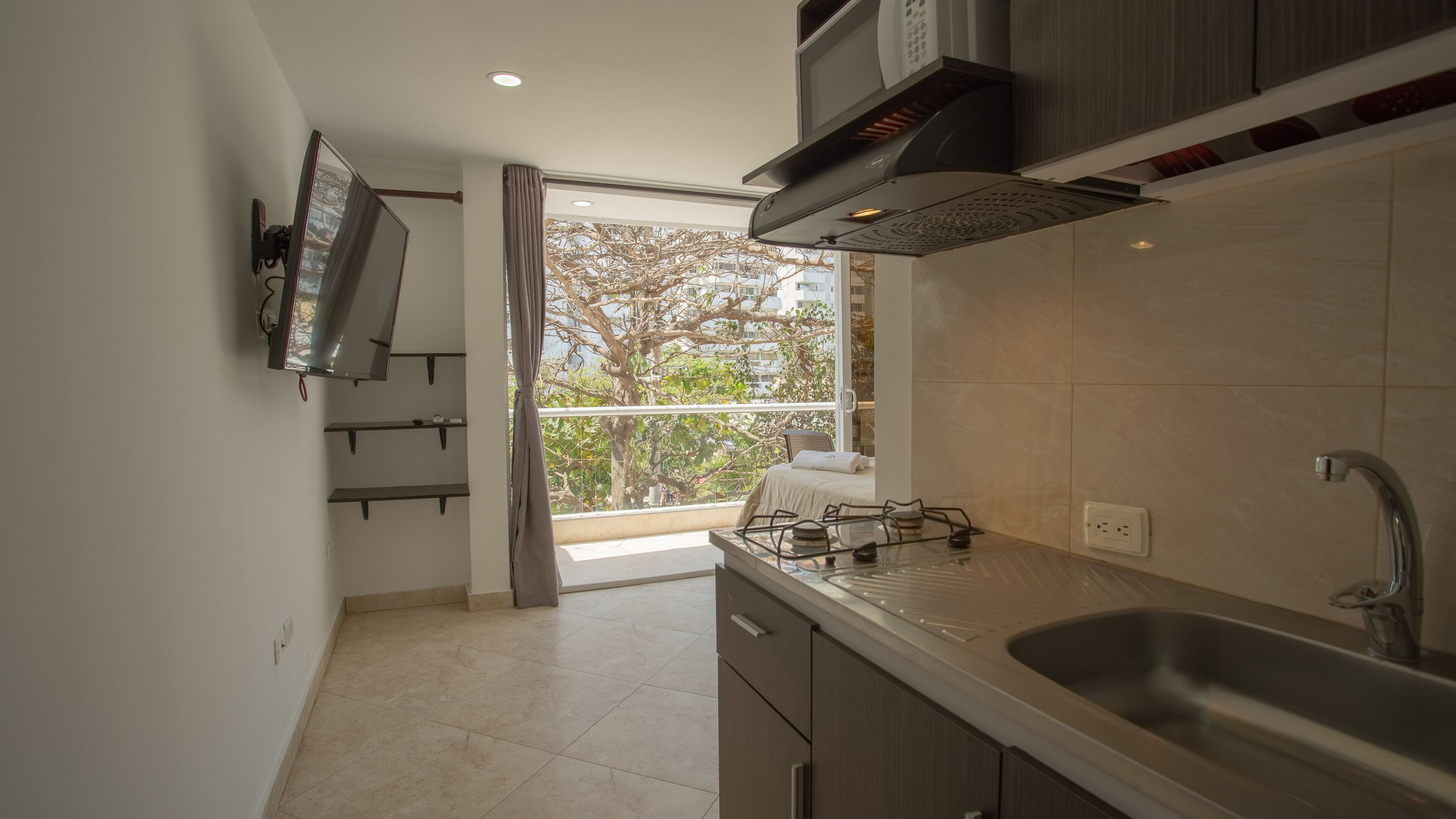 Deluxe Studio Suite, Partial Ocean View | Private kitchenette | Fridge, microwave, stovetop, cookware/dishes/utensils