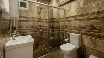 Shower, free toiletries, hair dryer, slippers