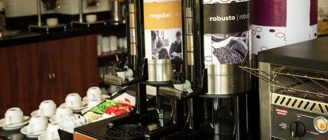A coffee station with multiple coffee dispensers labeled 'regular' and 'robusto'.