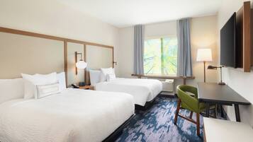 Desk, laptop workspace, iron/ironing board, free cribs/infant beds