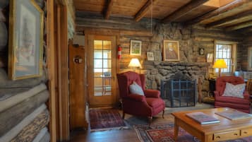 Cabin, 2 Bedrooms | Living area | Fireplace, books