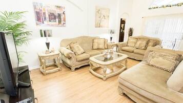 Flat-screen TV, video-game console, DVD player, foosball