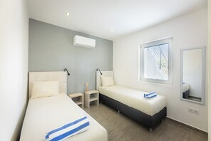 Comfort Apartment, 2 Bedrooms, Pool View, Poolside | In-room safe, desk, laptop workspace, iron/ironing board