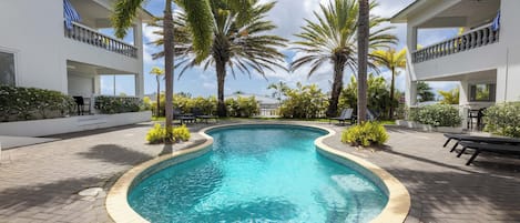 Outdoor pool, open 7:00 AM to 8:00 PM, pool umbrellas, pool loungers