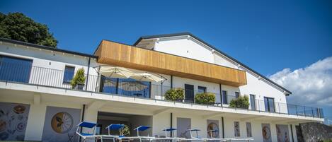 Seasonal outdoor pool, pool umbrellas, pool loungers