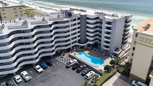 A multi-story hotel with a rooftop pool, parking area, and ocean view. - Nautilus 2310  Gulf View 2BD/2BA 3rd Floor.  Free Beach Service 3/1-10/31 (Ft Walton Beach)