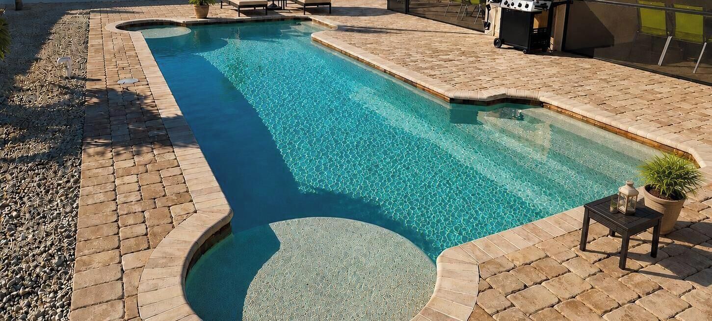 A heated pool, a lap pool, pool loungers