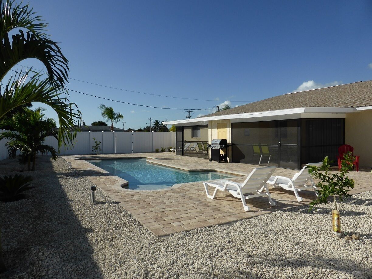 A heated pool, a lap pool, pool loungers