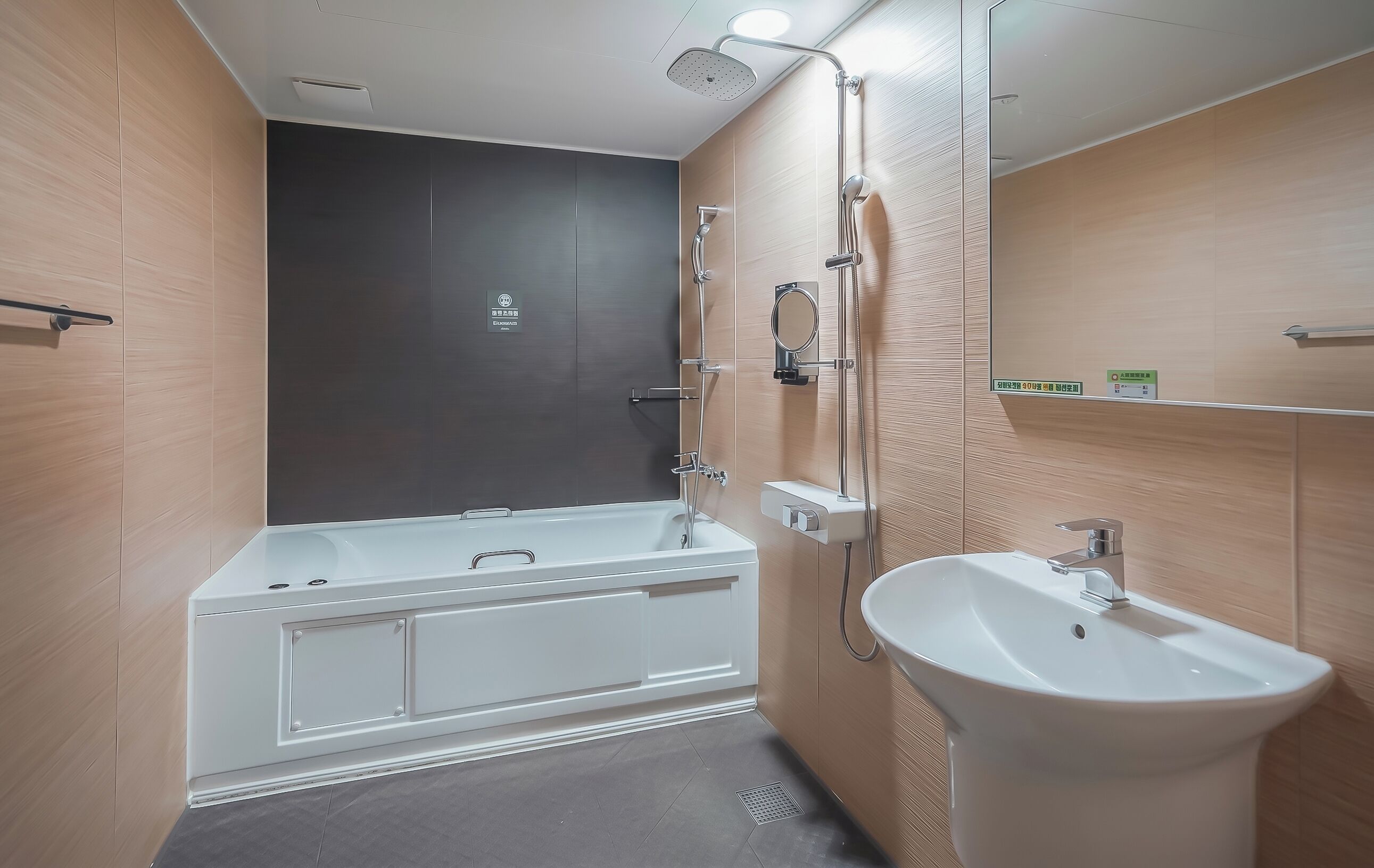 A modern bathroom with a bathtub, a sink, and a shower.