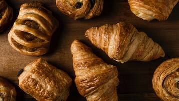 A variety of pastries on a wooden surface.
