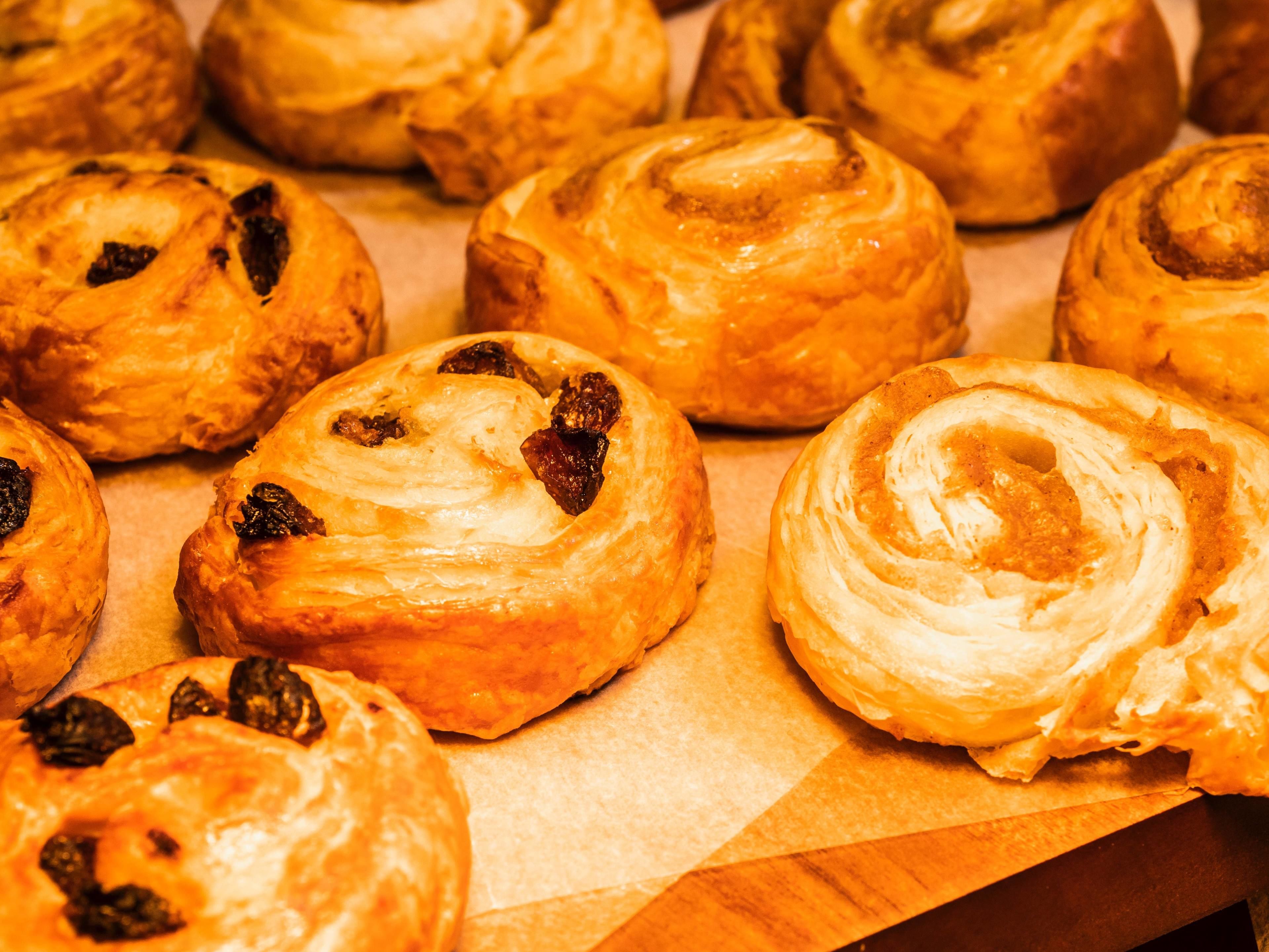 A variety of pastries on a wooden surface.