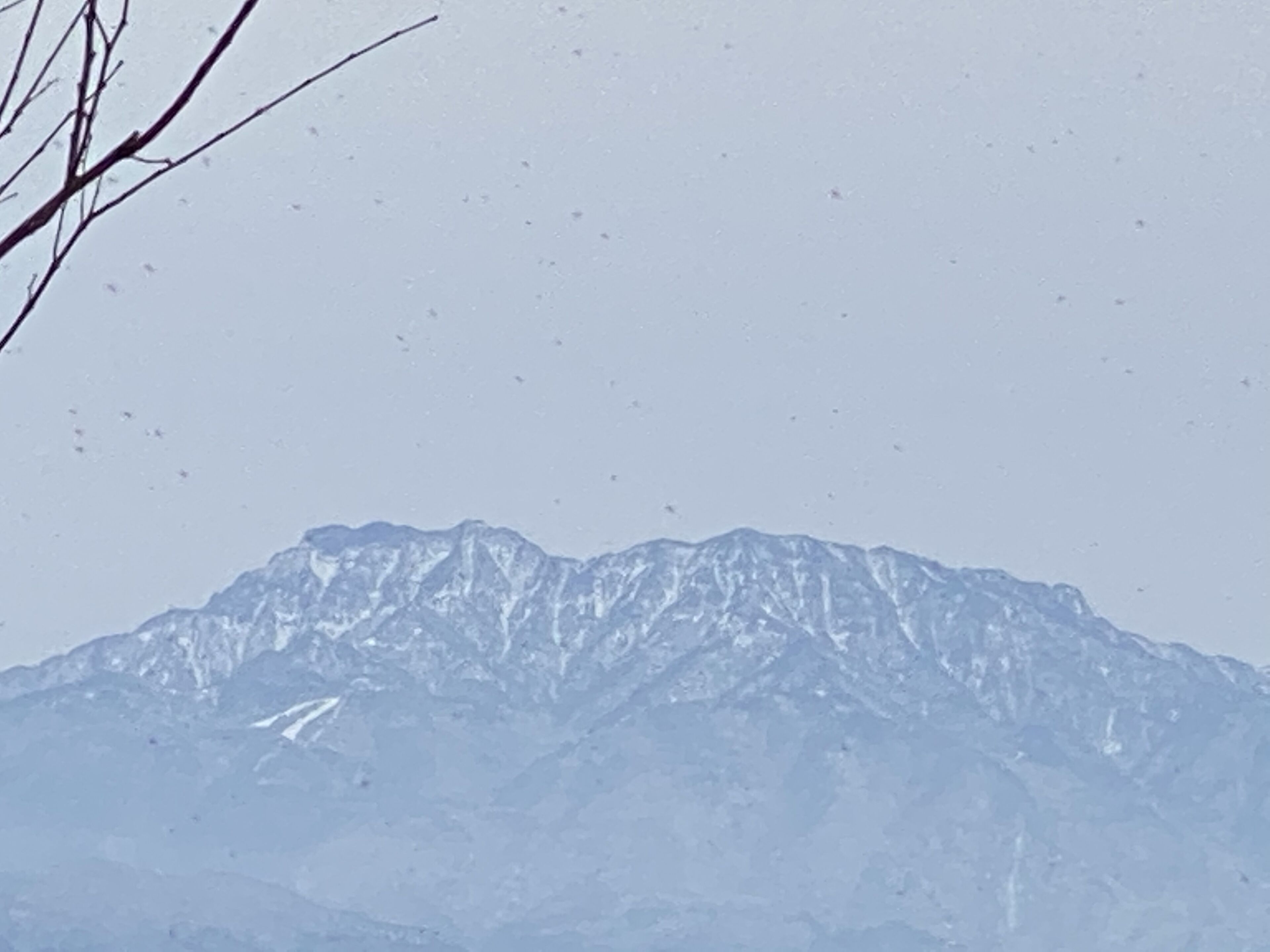 A mountain range with snow-covered peaks.