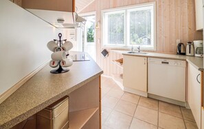 Fridge, stovetop, dishwasher, coffee/tea maker