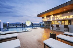 Outdoor pool, open 7 AM to 9:00 PM, pool umbrellas, pool loungers