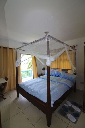 Comfort Apartment, 1 Bedroom, Ocean View, Beachside | 1 bedroom, in-room safe, desk, iron/ironing board - Stelia Seychelles (Mahé Island)