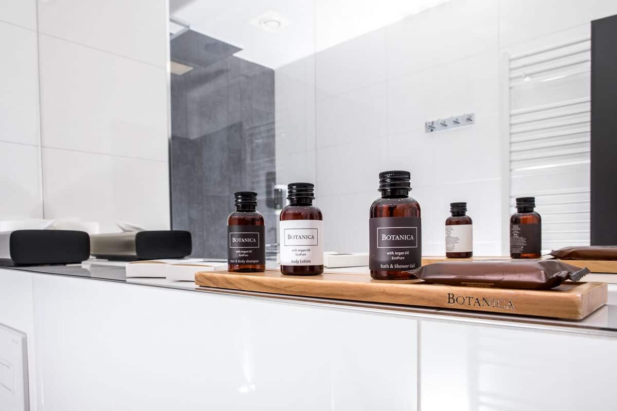 business double room | bathroom | designer toiletries, hair dryer, slippers, towels