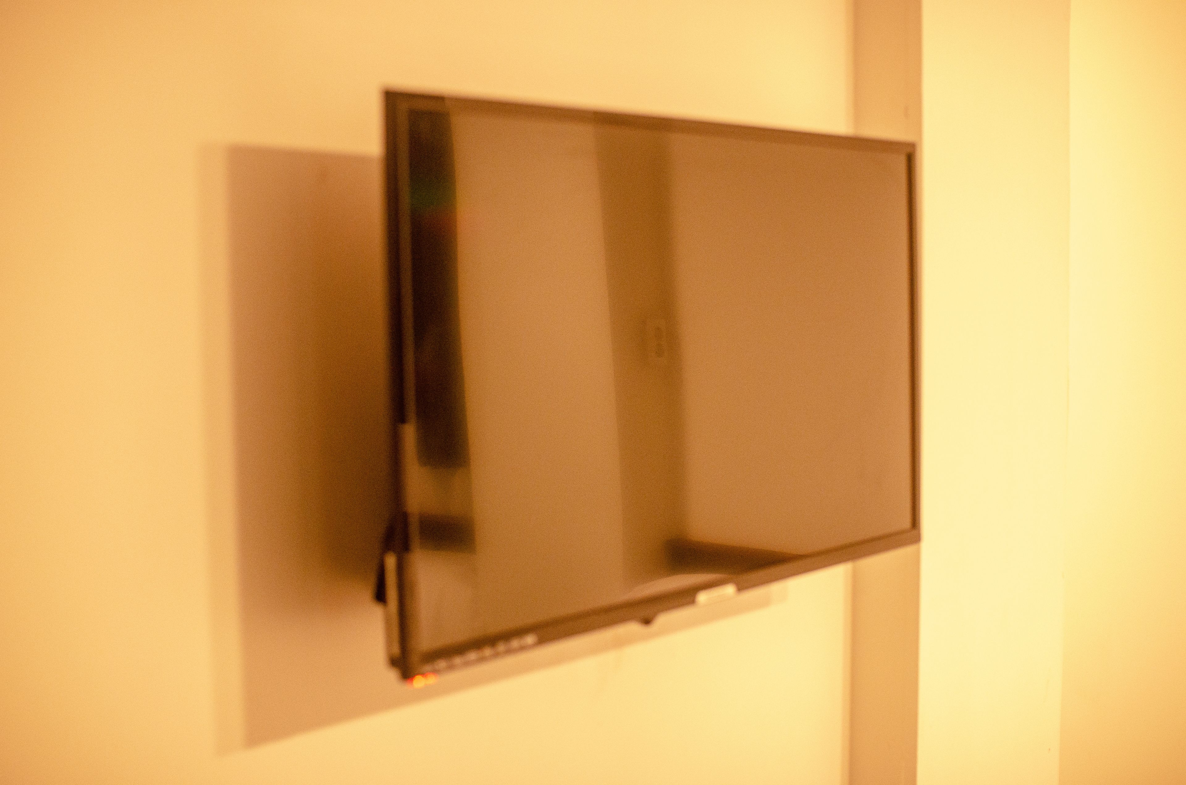 A flat-screen TV mounted on a wall.