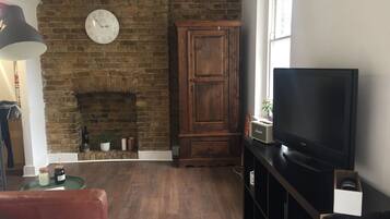 Apartment, 1 Bedroom | Living area | Flat-screen TV