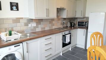 Fridge, microwave, oven, cookware/dishes/utensils