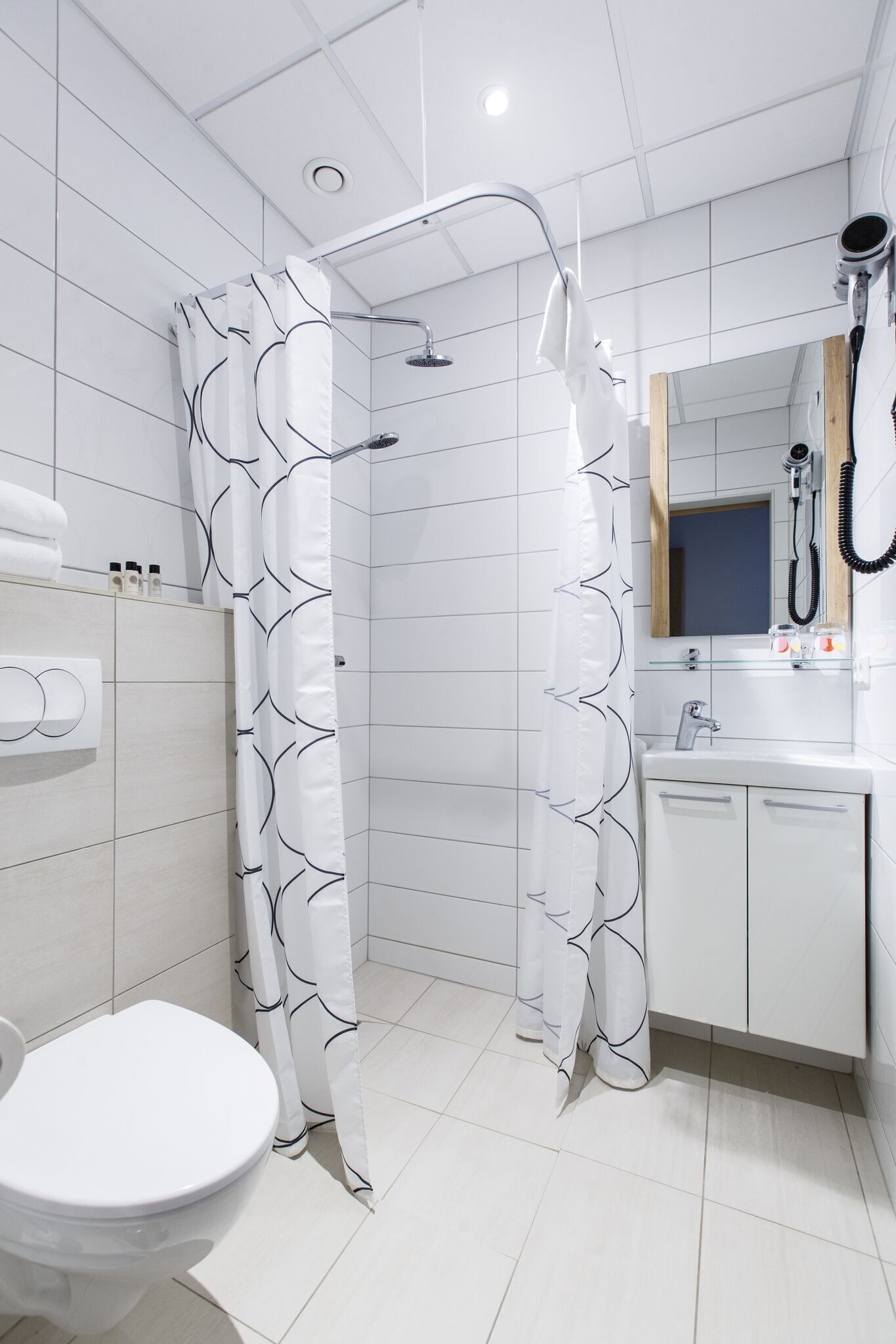 hair dryer, towels, soap, shampoo