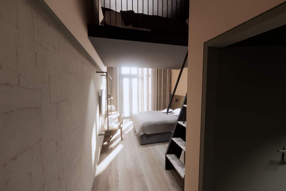 A narrow hallway leading to a bedroom with a bed, a desk, and a window with curtains.