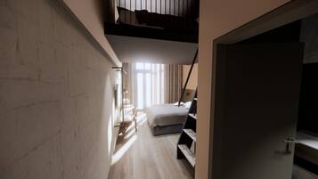 A narrow hallway leading to a bedroom with a bed, a desk, and a window with curtains.