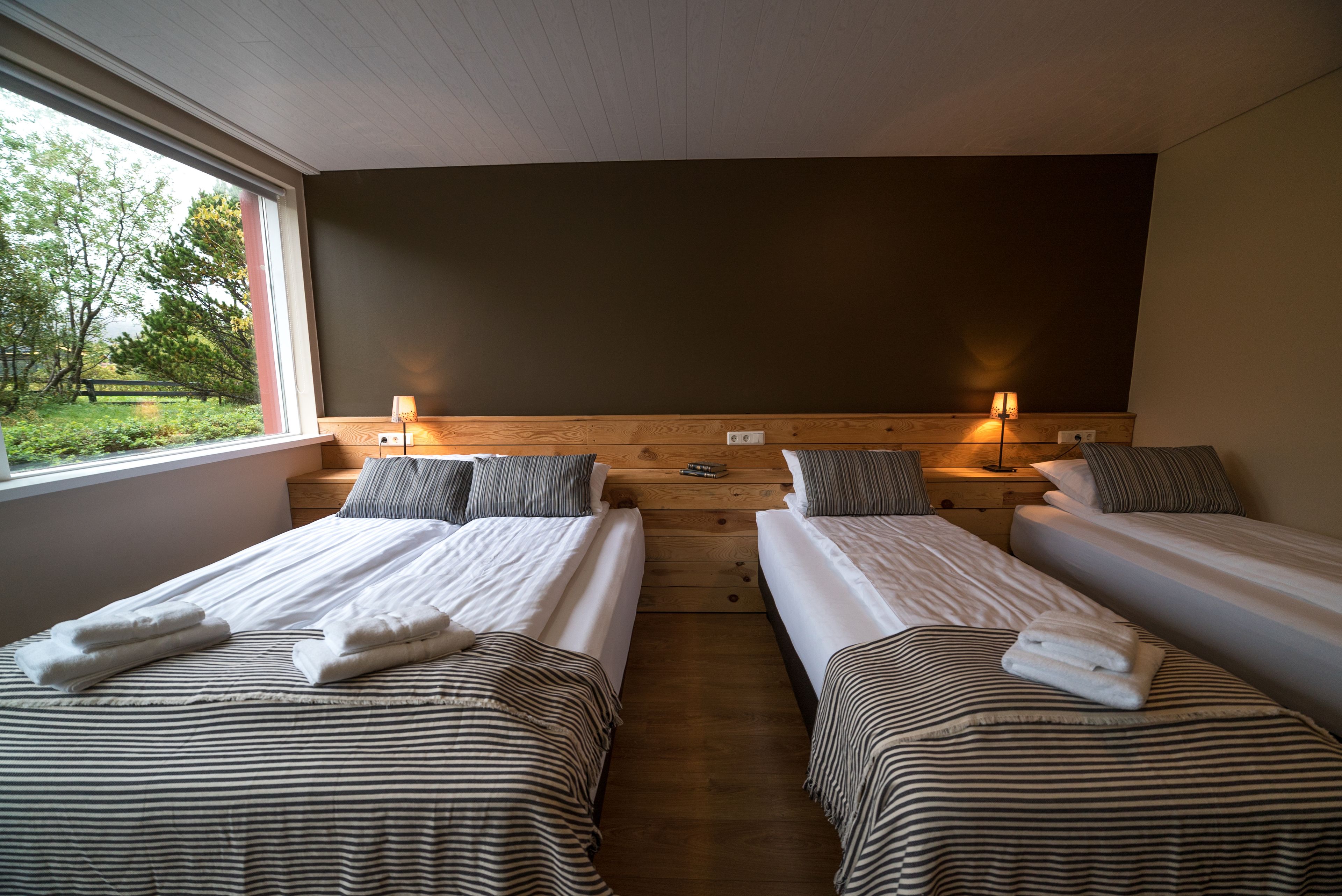 Family Suite, Private Bathroom | Blackout drapes, soundproofing, free WiFi, bed sheets