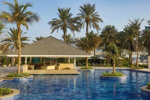 Outdoor pool, open 7:00 AM to 8:00 PM, pool loungers, lifeguards on site - Beach Rotana Residences (Abu Dhabi)