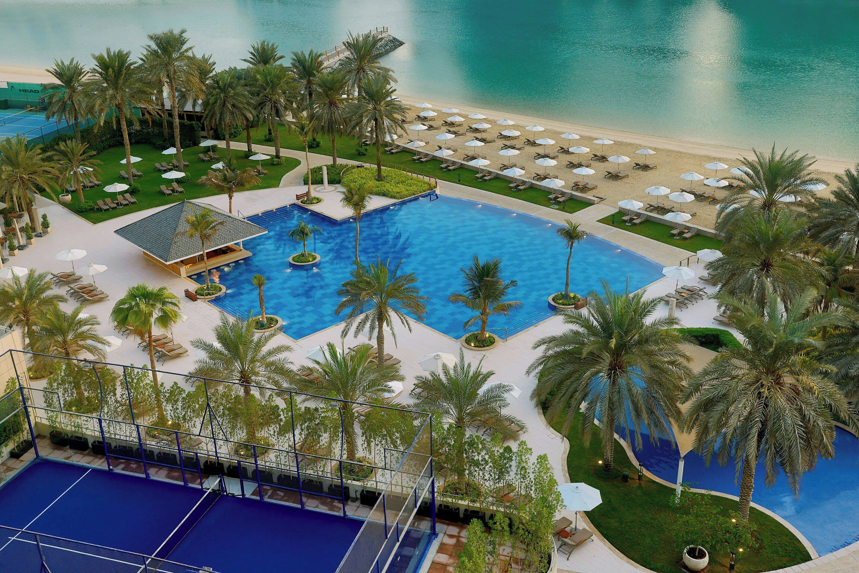 Outdoor pool, open 7:00 AM to 8:00 PM, pool loungers, lifeguards on site