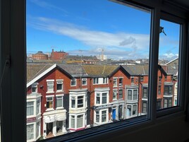 A view of terraced houses with a prominent building labeled "Eastgate Hotel" in the foreground.
