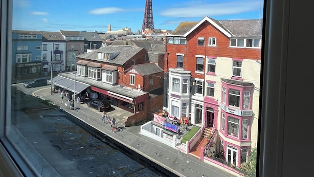 A view of a street with buildings, a tower, and a clear blue sky. - Fairhaven Hotel Central Blackpool (Blackpool)
