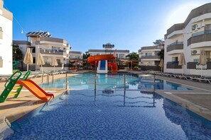 Indoor pool, outdoor pool, pool umbrellas, sun loungers