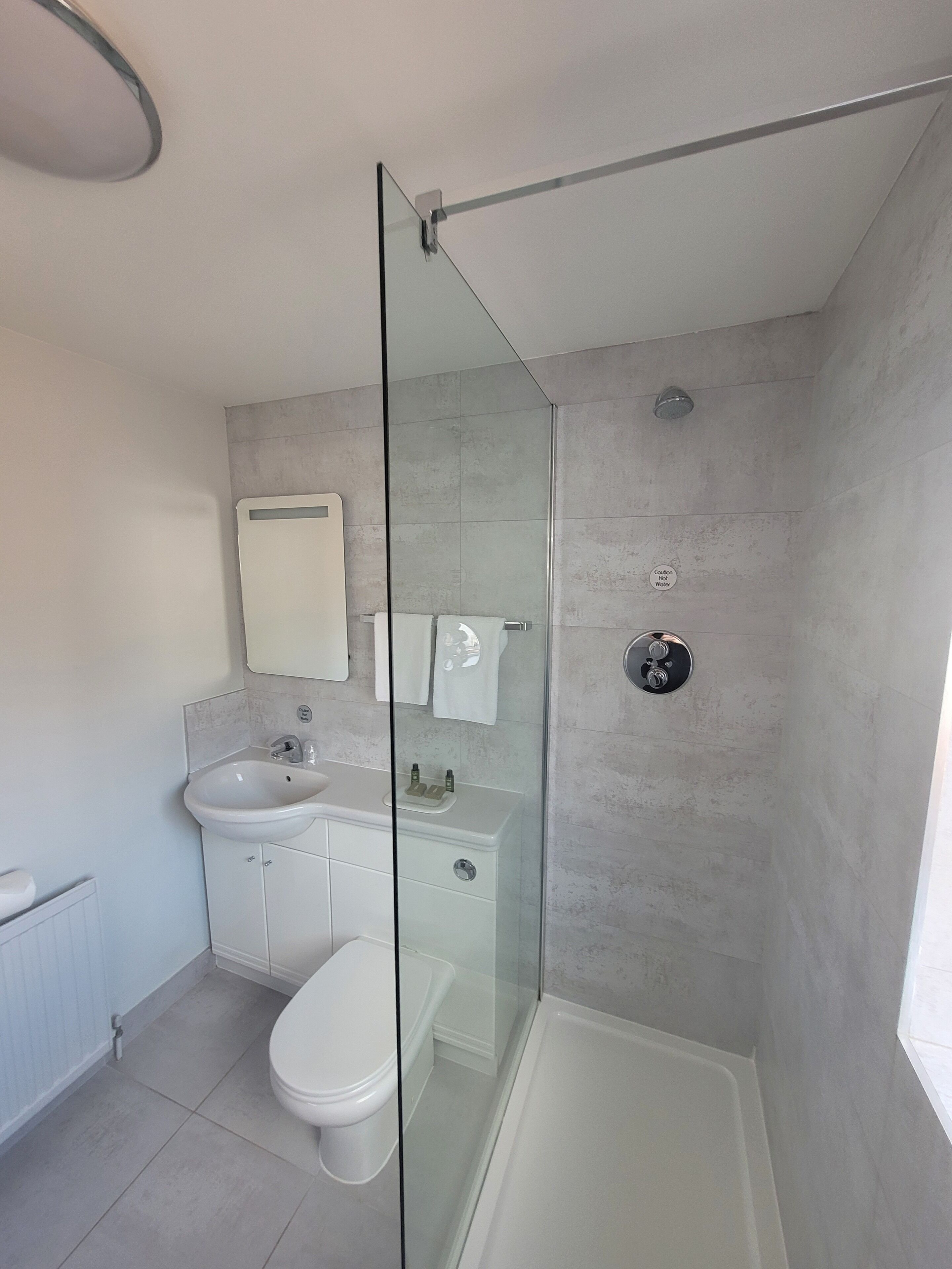 shower, free toiletries, hair dryer, towels