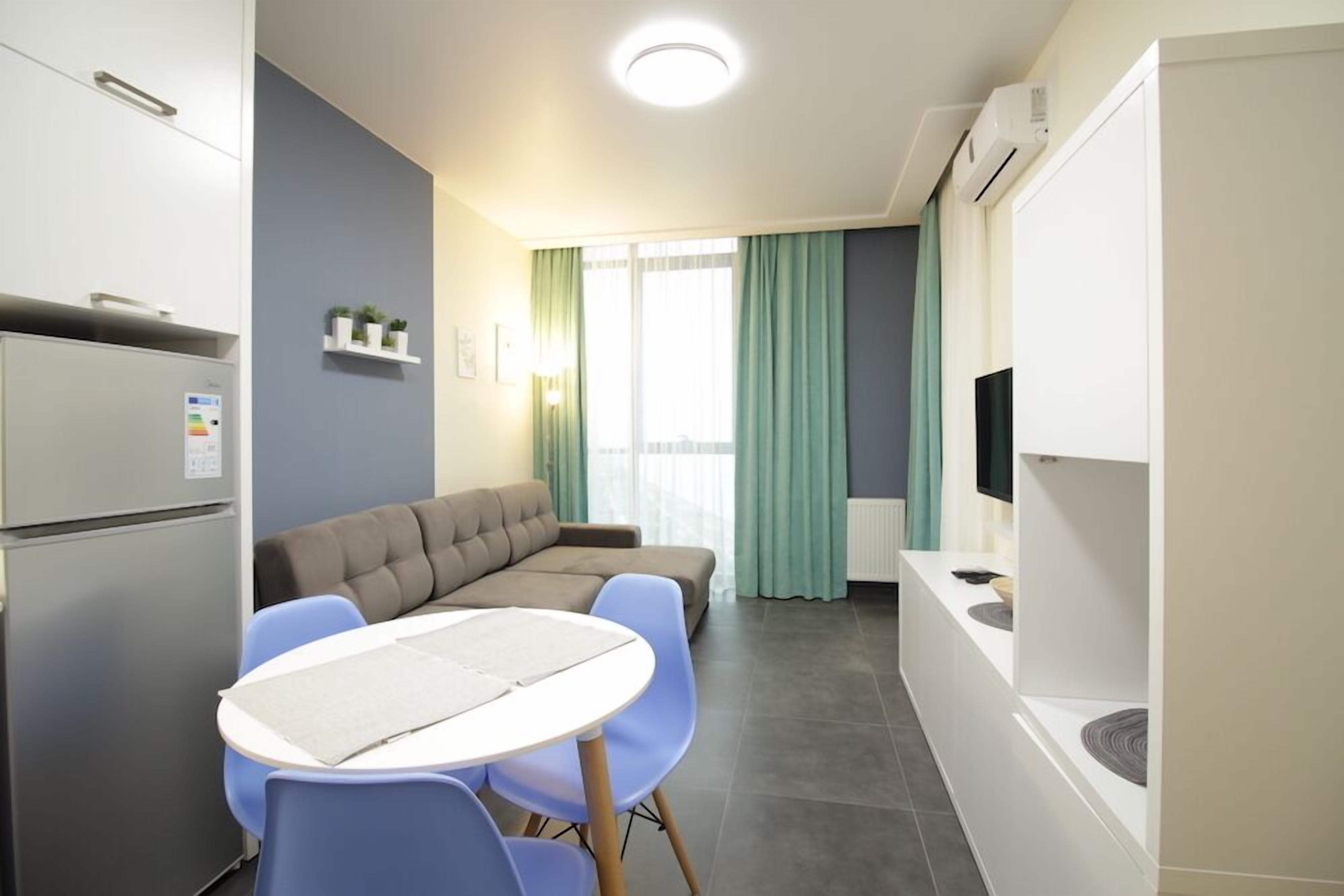 Departamento, 1 habitación | Área de sala de estar | Televisión de pantalla plana 