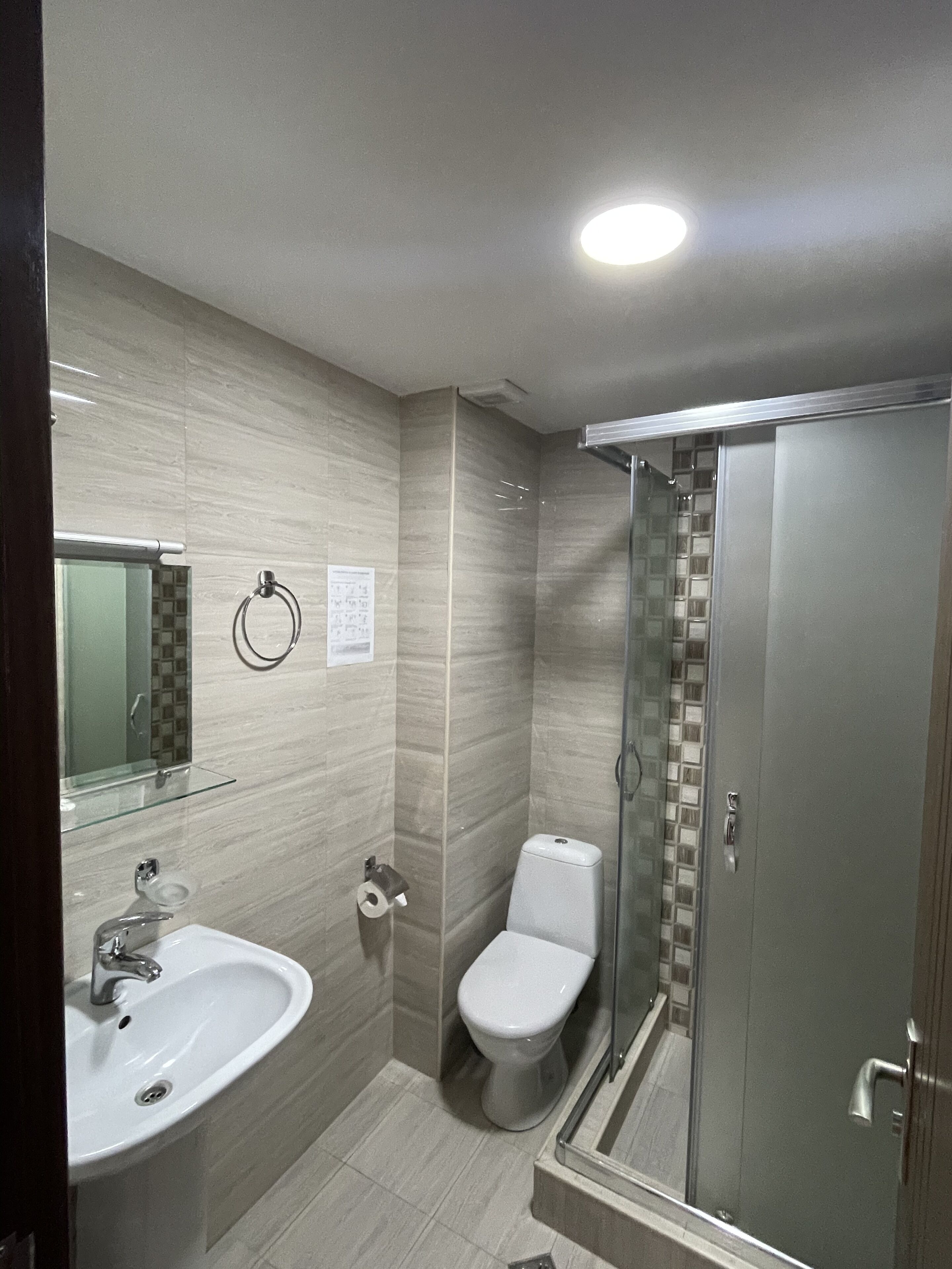 economy double room | bathroom | shower, free toiletries, hair dryer, bathrobes