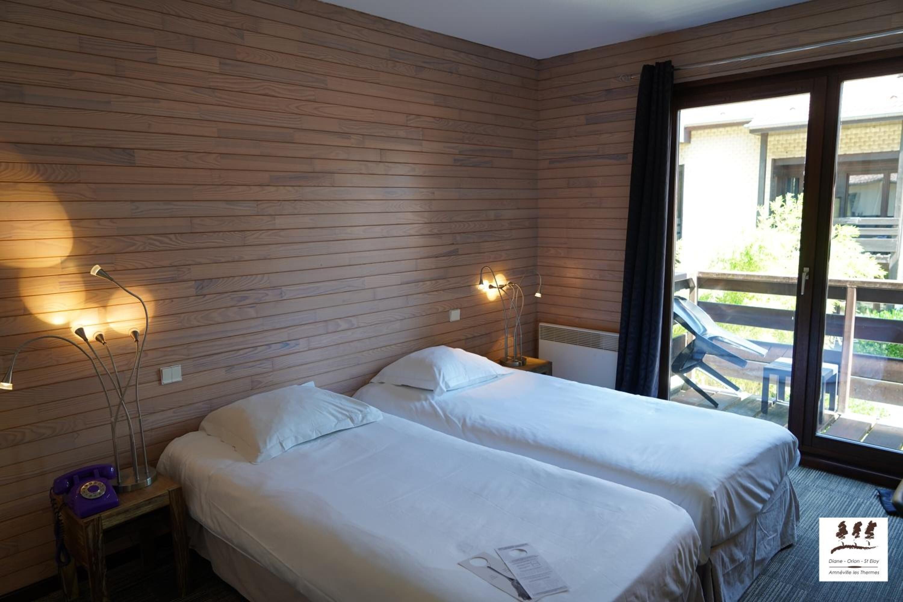 Laptop workspace, blackout curtains, iron/ironing board, rollaway beds