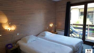 Laptop workspace, blackout curtains, iron/ironing board, rollaway beds