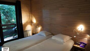 Laptop workspace, blackout curtains, iron/ironing board, rollaway beds