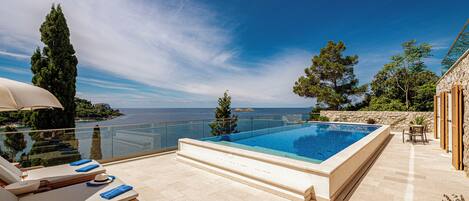 Seasonal outdoor pool, pool umbrellas, pool loungers