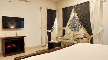 Deluxe Room, 1 King Bed, City View | Minibar, desk, laptop workspace, iron/ironing board