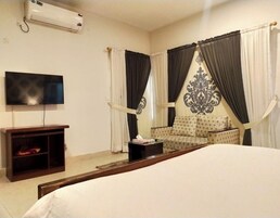 Minibar, desk, laptop workspace, iron/ironing board