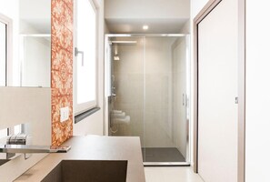 Shower, bathrobes, bidet, towels