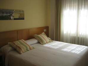 Desk, laptop workspace, free WiFi, bed sheets