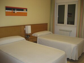 Desk, laptop workspace, free WiFi, bed sheets
