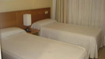 Desk, laptop workspace, free WiFi, bed sheets