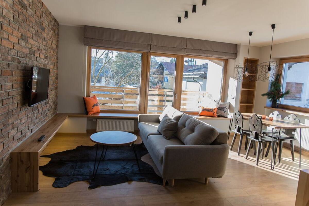 Condo, balcón (Olympia) | Área de sala de estar | Televisión de pantalla plana