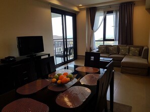 c202 | Living area | TV - 1BR Unit Sea Breeze Veranda Anvaya C202 (Morong)
