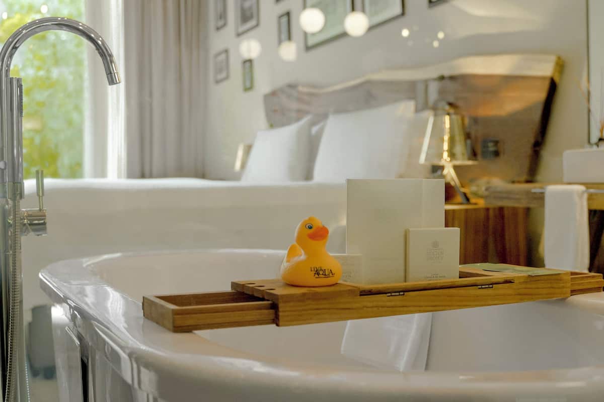 deluxe interior garden view, 1 king | bathroom | separate bathtub and shower, deep-soaking bathtub, rainfall showerhead