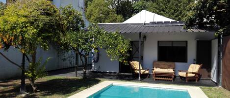 Seasonal outdoor pool, pool loungers